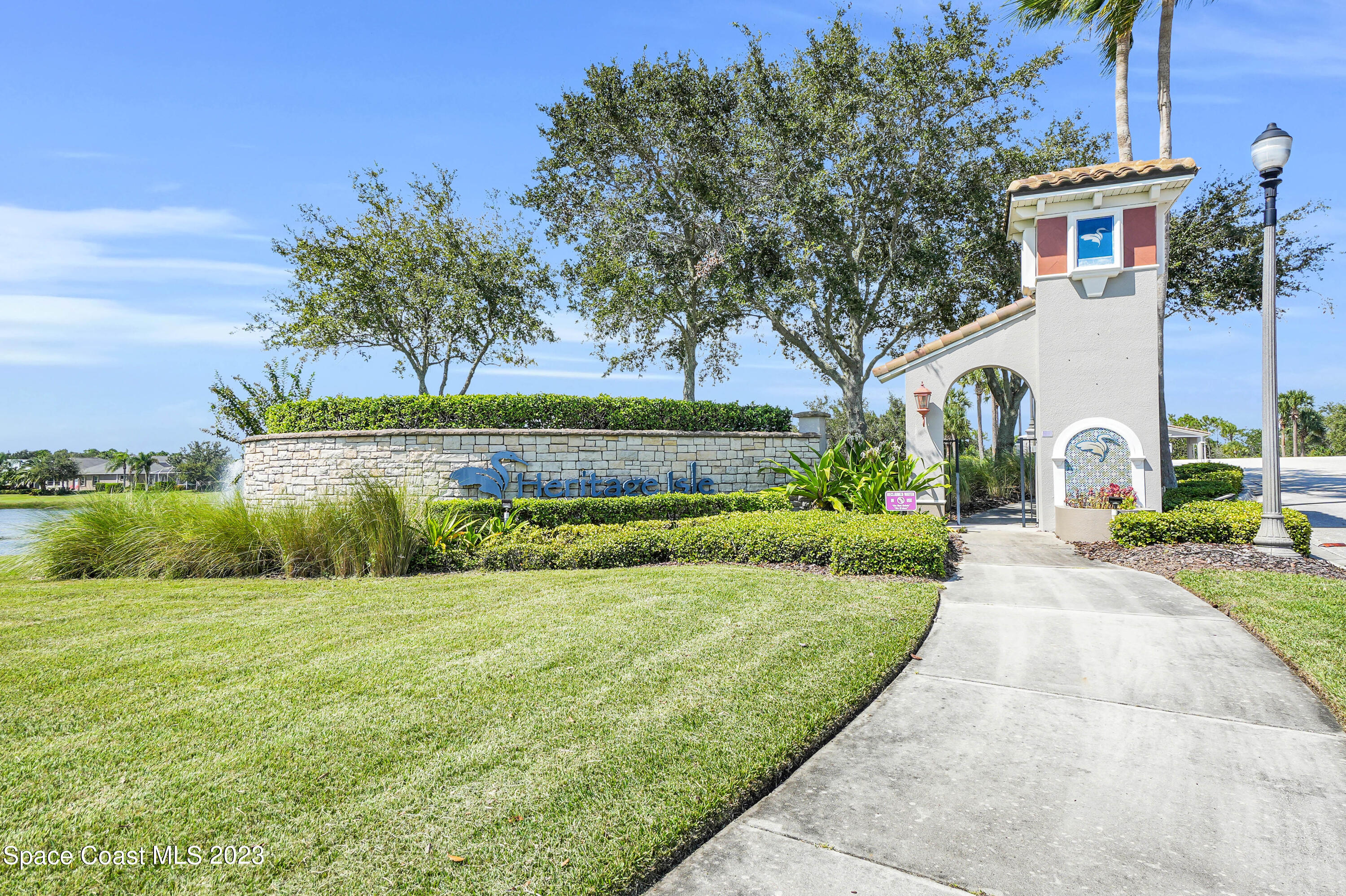 5928 Van Ness Drive Melbourne, FL 32940 - Photo 31 of 35 a view of a house with a yard and a patio