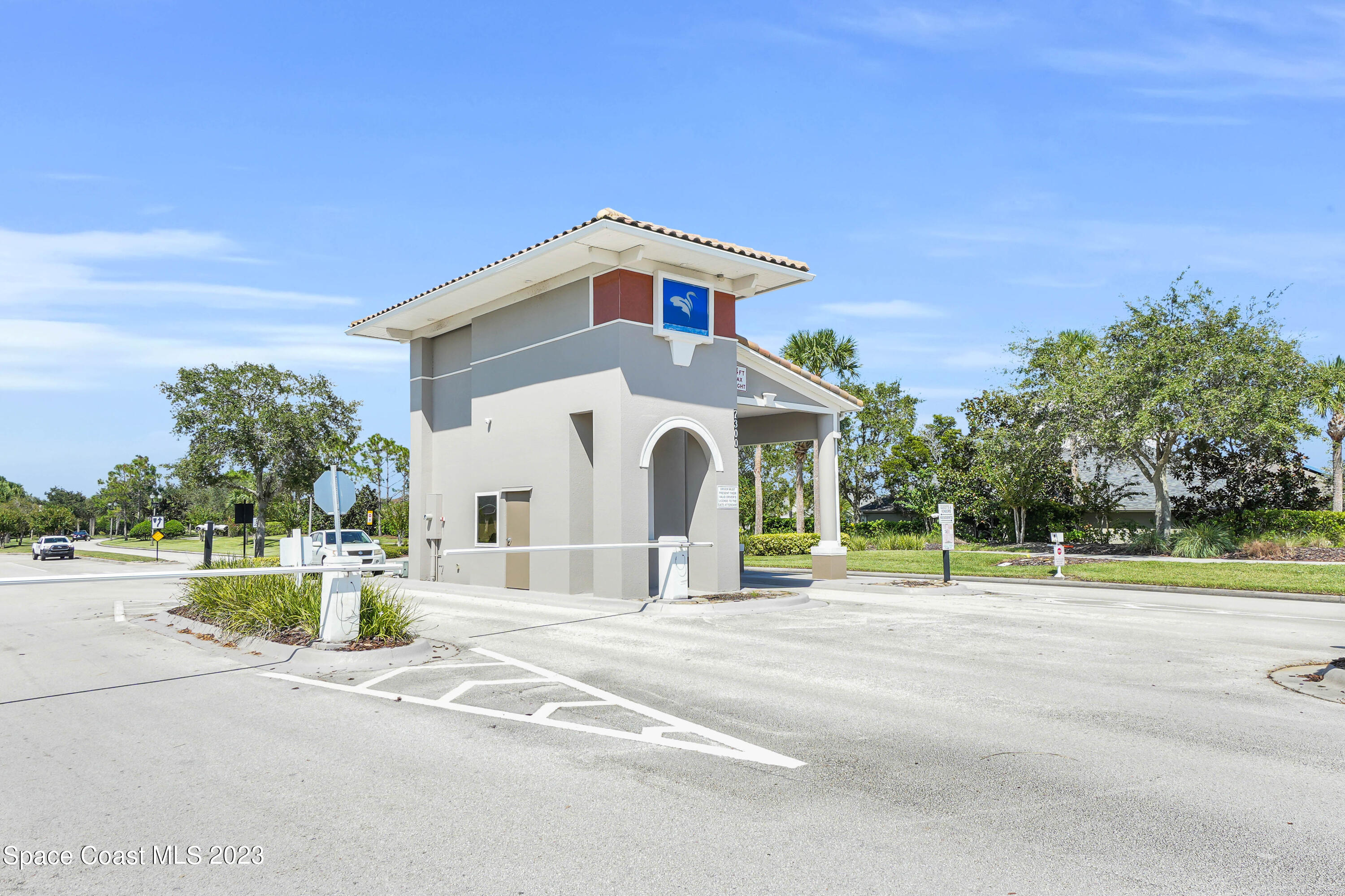 5928 Van Ness Drive Melbourne, FL 32940 - Photo 32 of 35 a view of a house with a yard and palm trees
