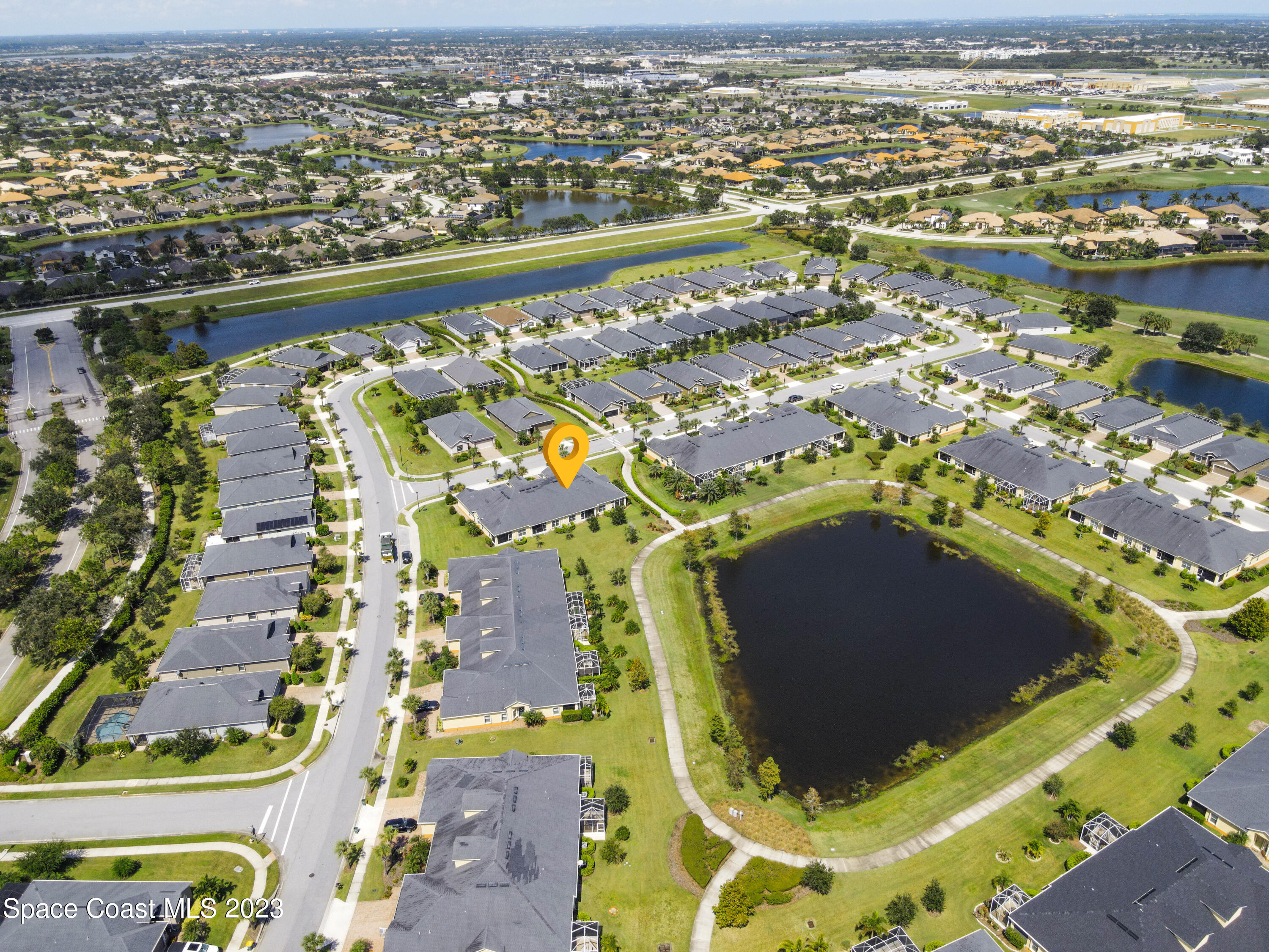 5928 Van Ness Drive Melbourne, FL 32940 - Photo 34 of 35 an aerial view of residential houses with outdoor space