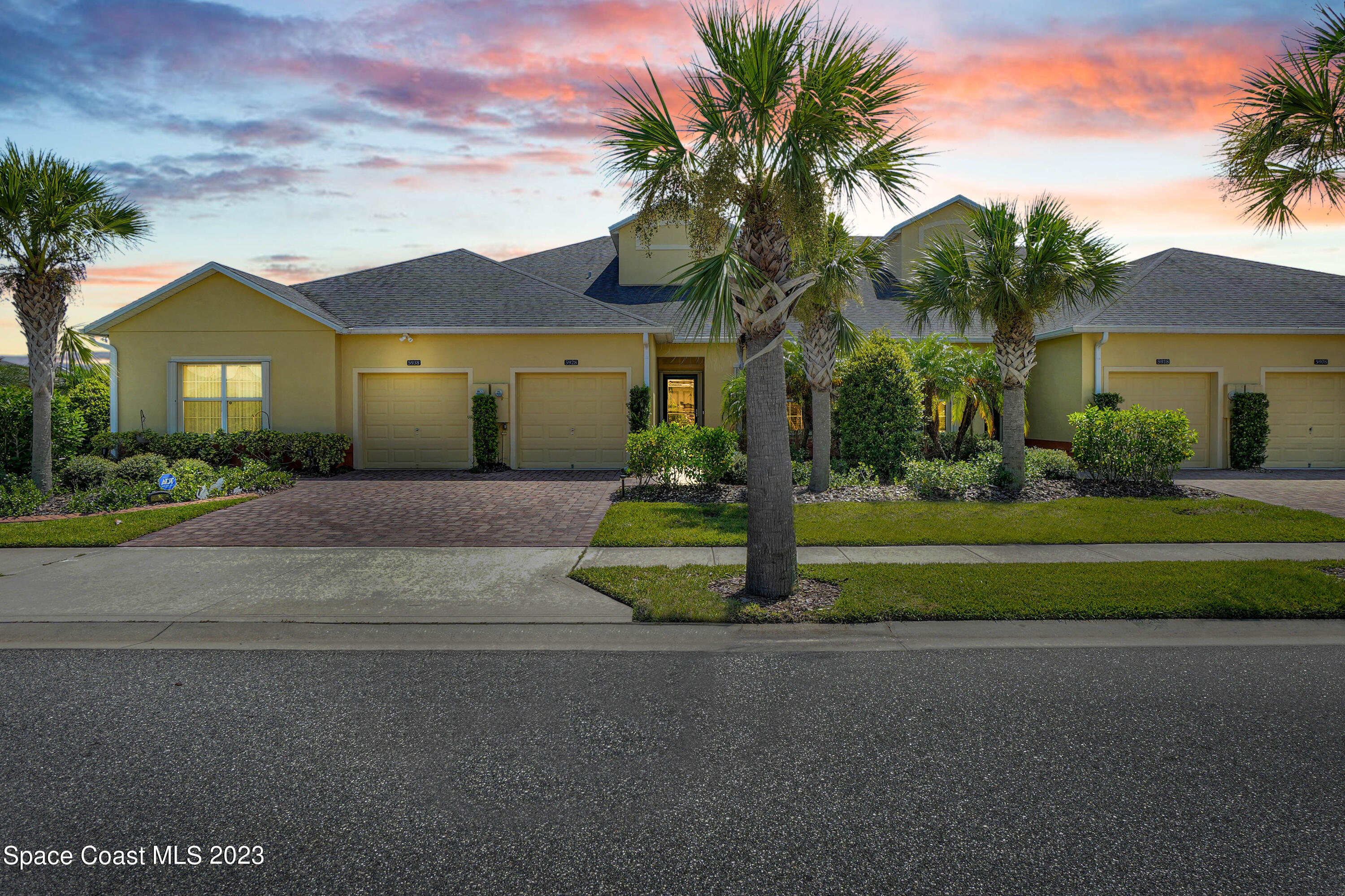 5928 Van Ness Drive Melbourne, FL 32940 - Photo 4 of 35 a view of a house with a yard and palm trees