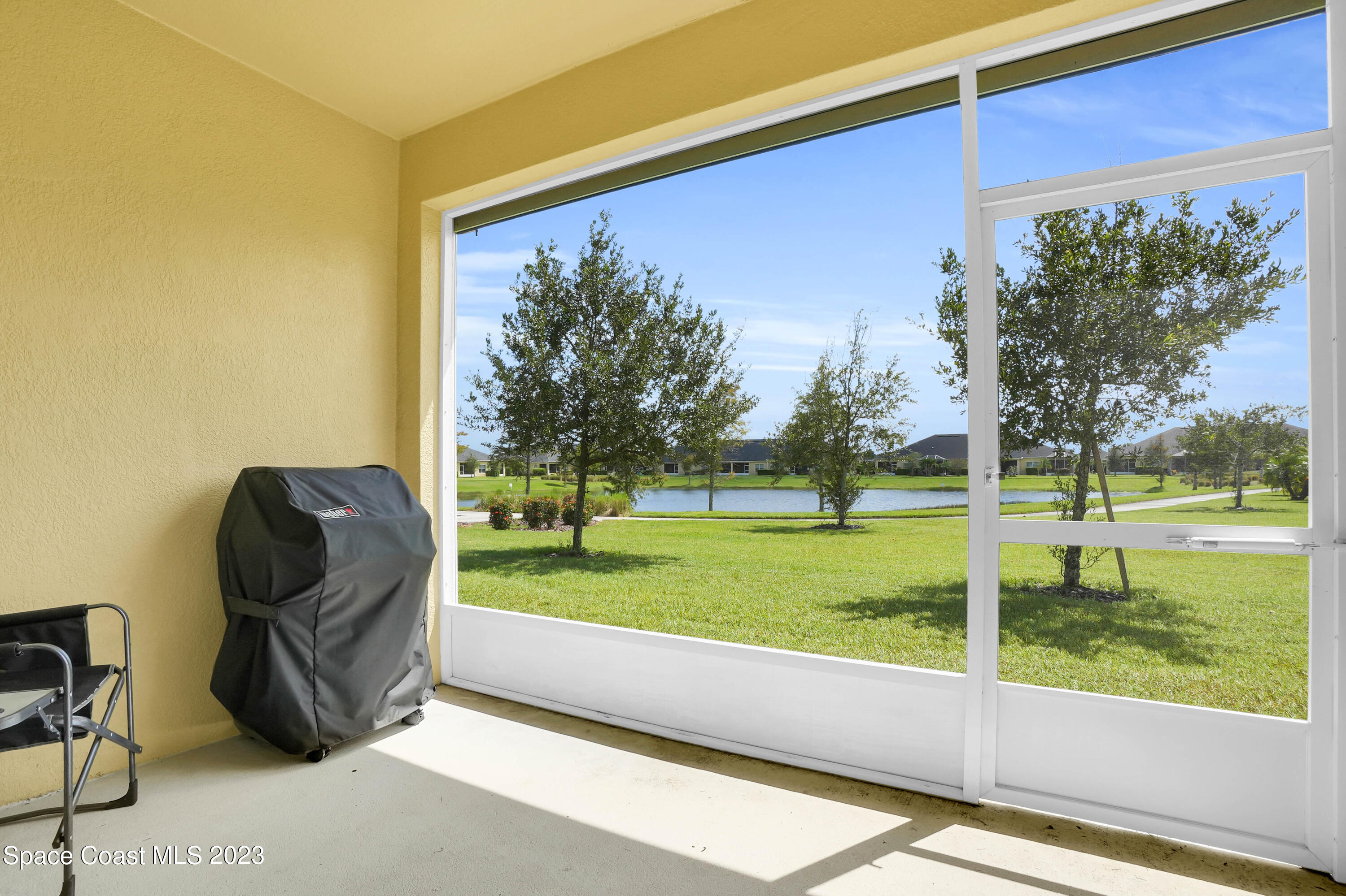 5928 Van Ness Drive Melbourne, FL 32940 - Photo 5 of 35 a view of a back yard from a room