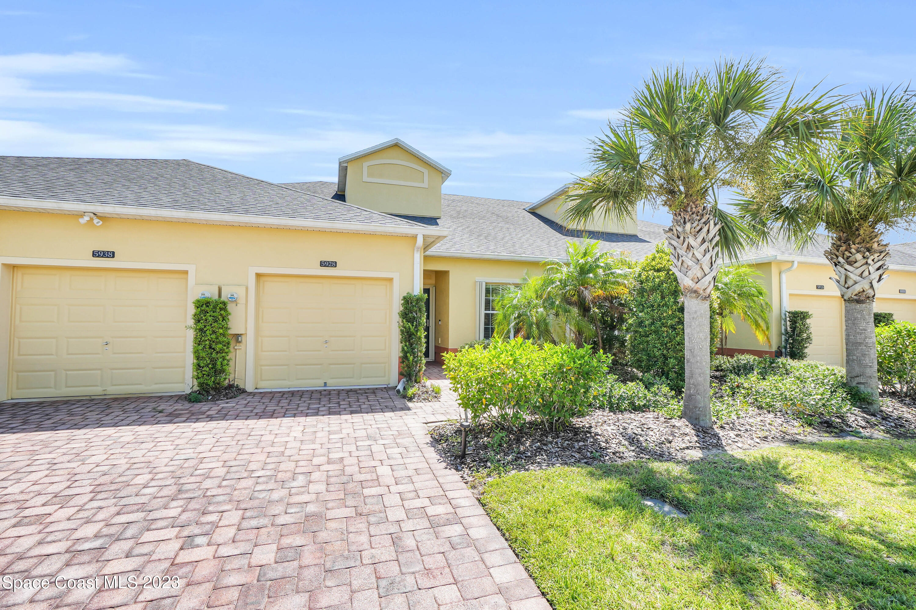 5928 Van Ness Drive Melbourne, FL 32940 - Photo 6 of 35 a front view of a house with garden
