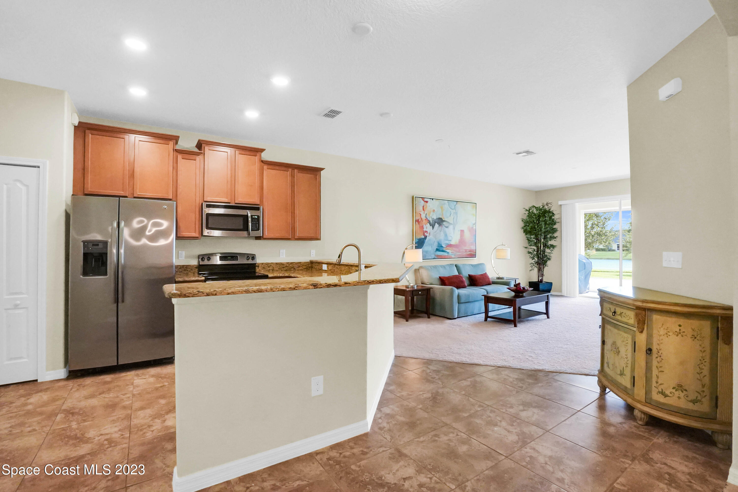 5928 Van Ness Drive Melbourne, FL 32940 - Photo 9 of 35 a view of living room filled with furniture and a window