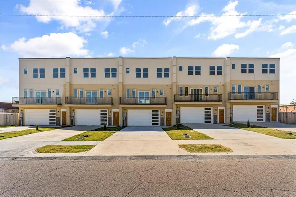 a view of a house with swimming pool and sitting area