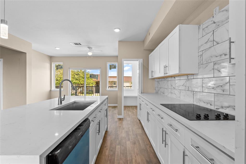 3607 Portland Street Irving, TX 75062 - Photo 15 of 25 a kitchen with a sink stove and cabinets