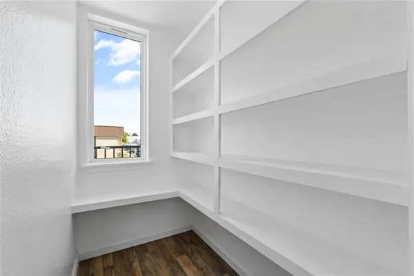 a view of an empty walk in closet