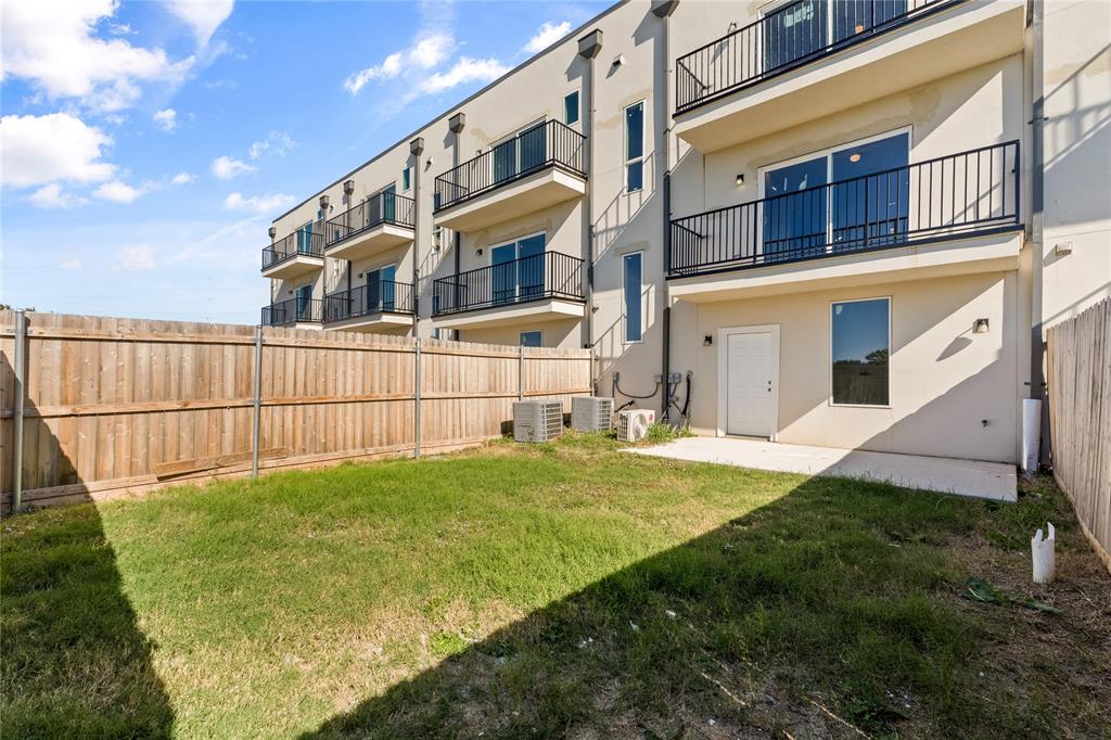 3607 Portland Street Irving, TX 75062 - Photo 22 of 25 a view of an white house with a yard