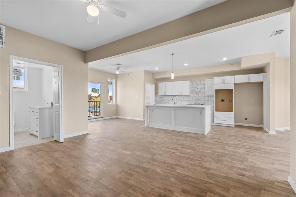 3607 Portland Street Irving, TX 75062 - Photo 7 of 25 a view of a kitchen with a sink and a refrigerator