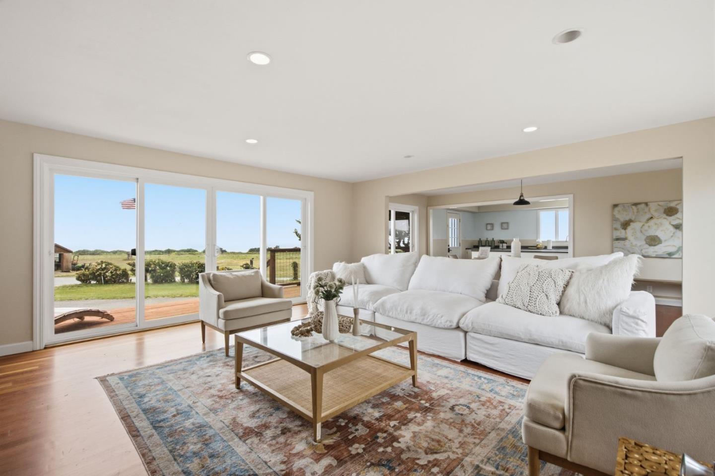 1263 Reservoir Road Pescadero, CA 94060 - Photo 22 of 66 a living room with furniture and a large window