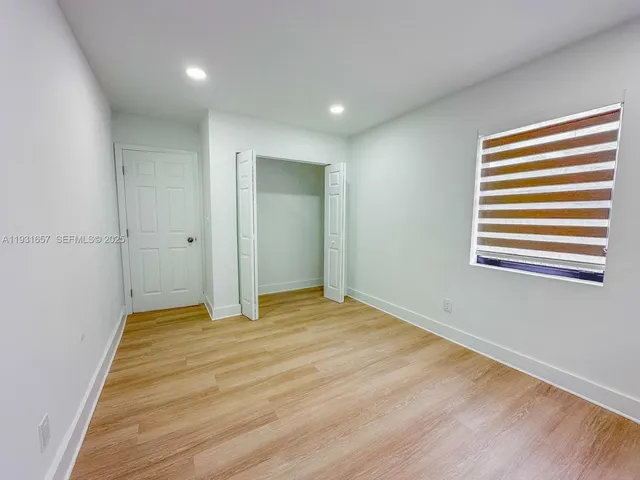 a bathroom with a sink a washer and dryer