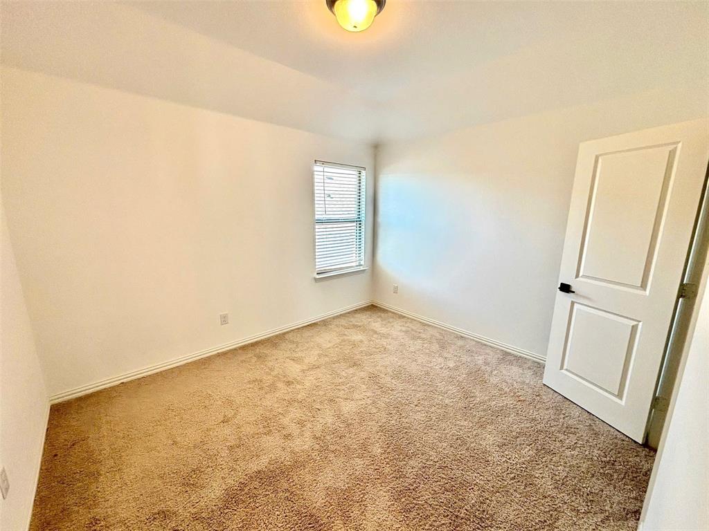 512 Virginia Way Princeton, TX 75407 - Photo 18 of 30 an empty room with windows