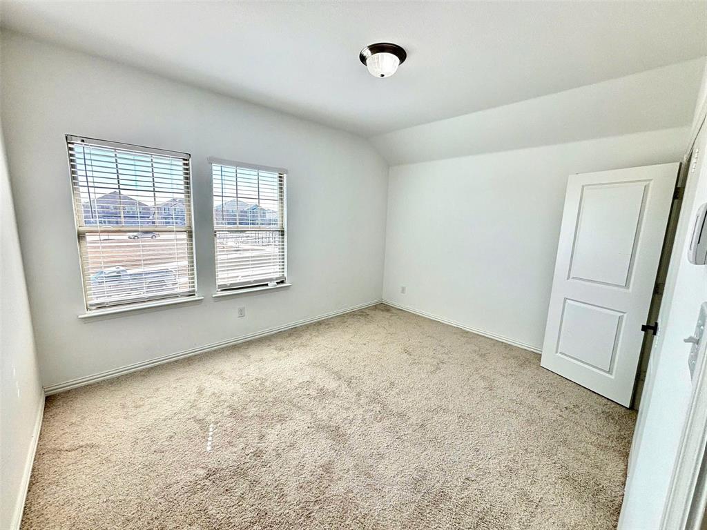 512 Virginia Way Princeton, TX 75407 - Photo 26 of 30 a view of an empty room with a window