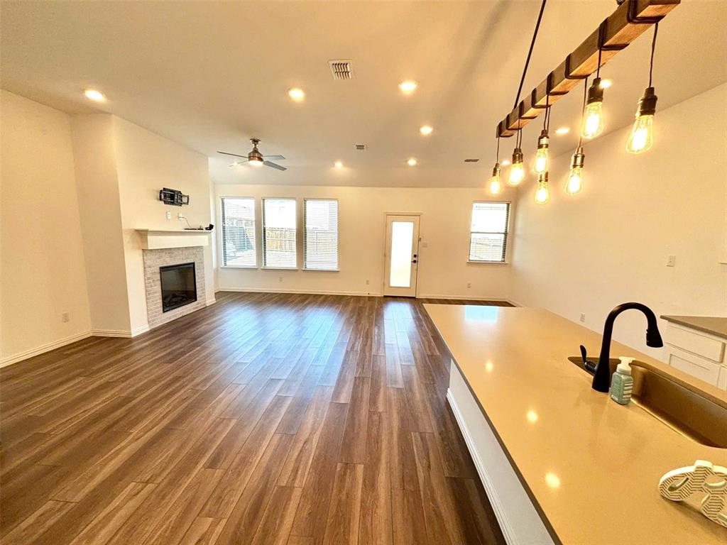 512 Virginia Way Princeton, TX 75407 - Photo 8 of 30 a view of a room with wooden floor and staircase
