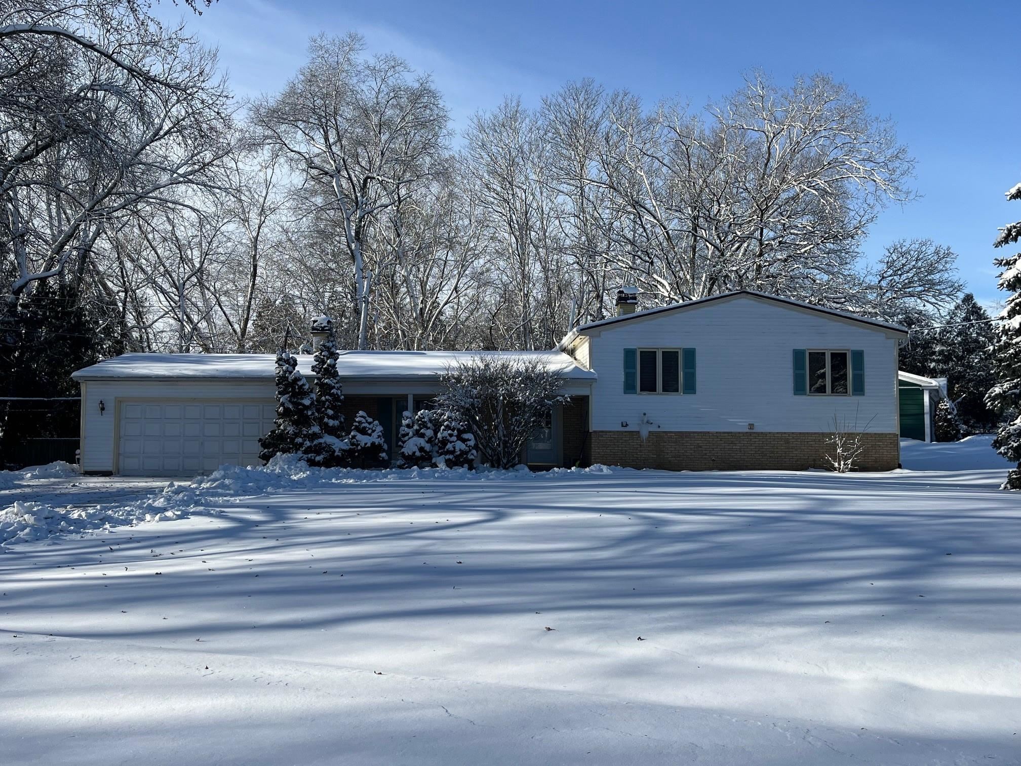 4909 Mohawk Road Rockford, IL 61107 - Photo 1 of 44 a view of a house with a yard