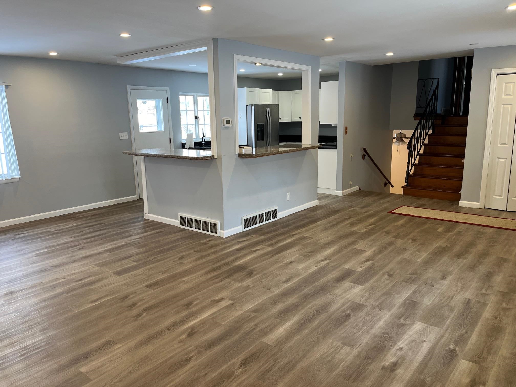 4909 Mohawk Road Rockford, IL 61107 - Photo 11 of 44 an empty room with wooden floor and windows