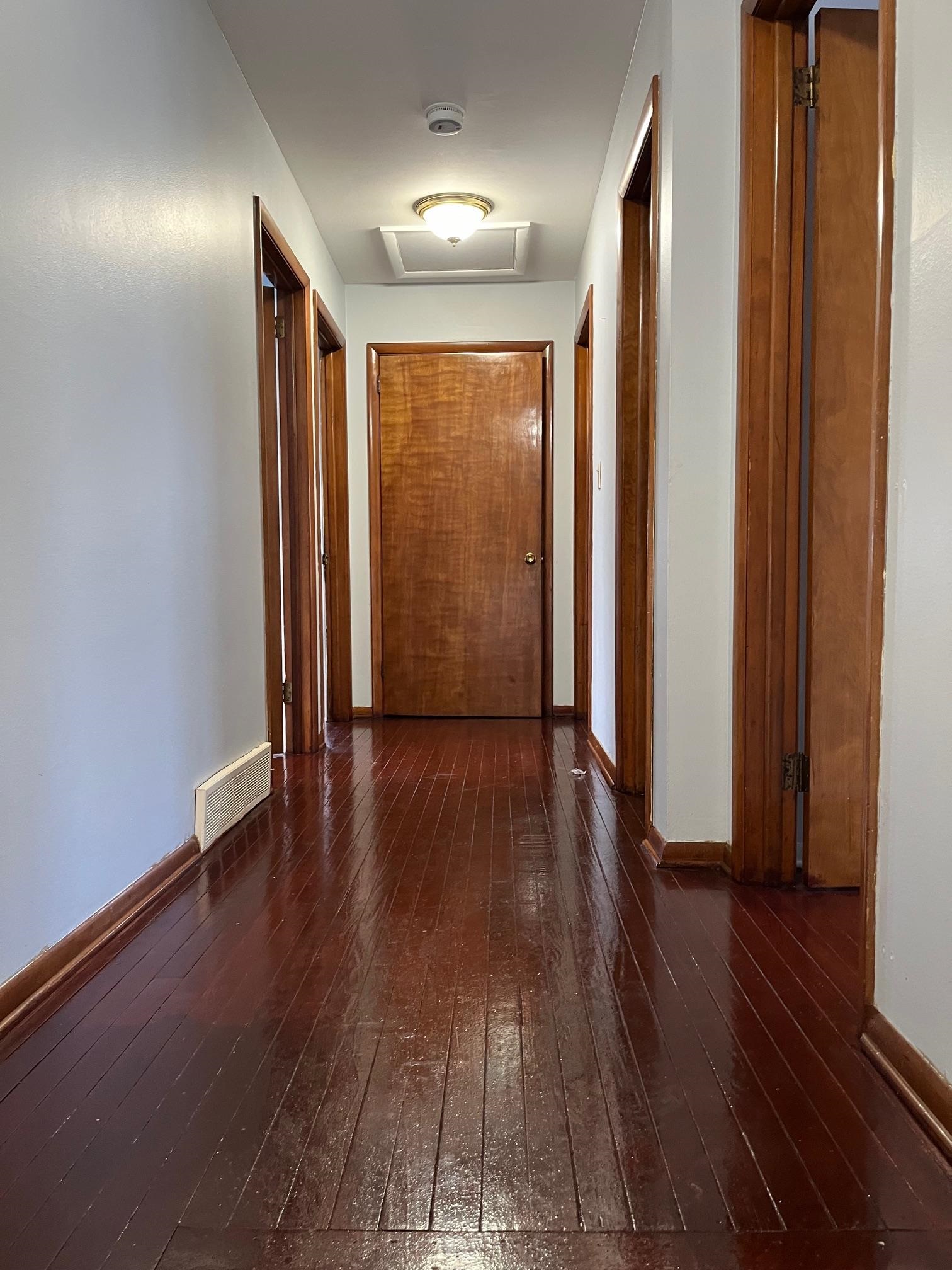 4909 Mohawk Road Rockford, IL 61107 - Photo 13 of 44 a view of a hallway with wooden floor