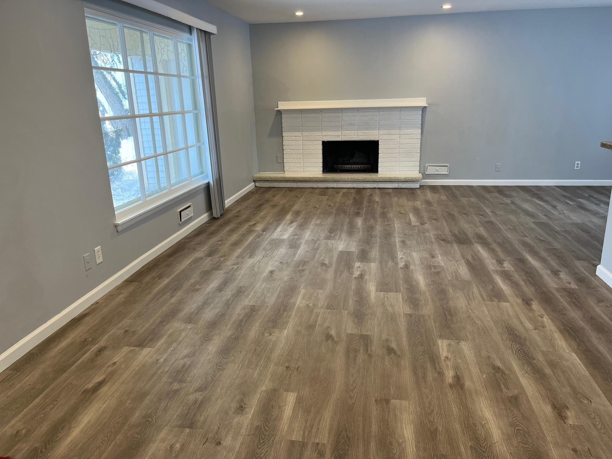 4909 Mohawk Road Rockford, IL 61107 - Photo 2 of 44 a view of empty room with fireplace and wooden floor