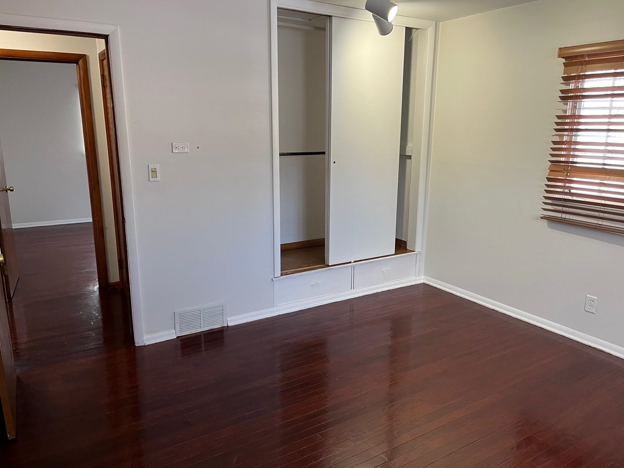 4909 Mohawk Road Rockford, IL 61107 - Photo 22 of 44 an empty room with wooden floor and windows
