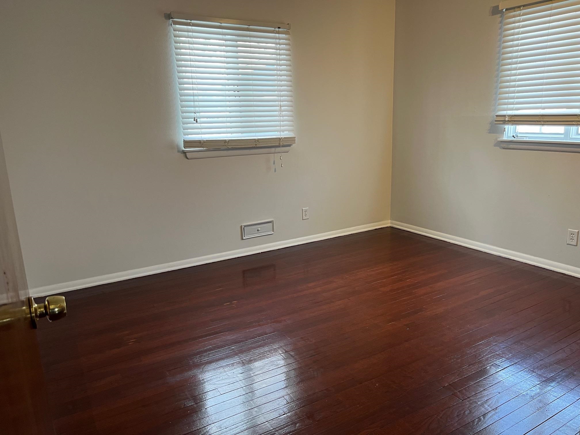 4909 Mohawk Road Rockford, IL 61107 - Photo 23 of 44 an empty room with wooden floor and windows