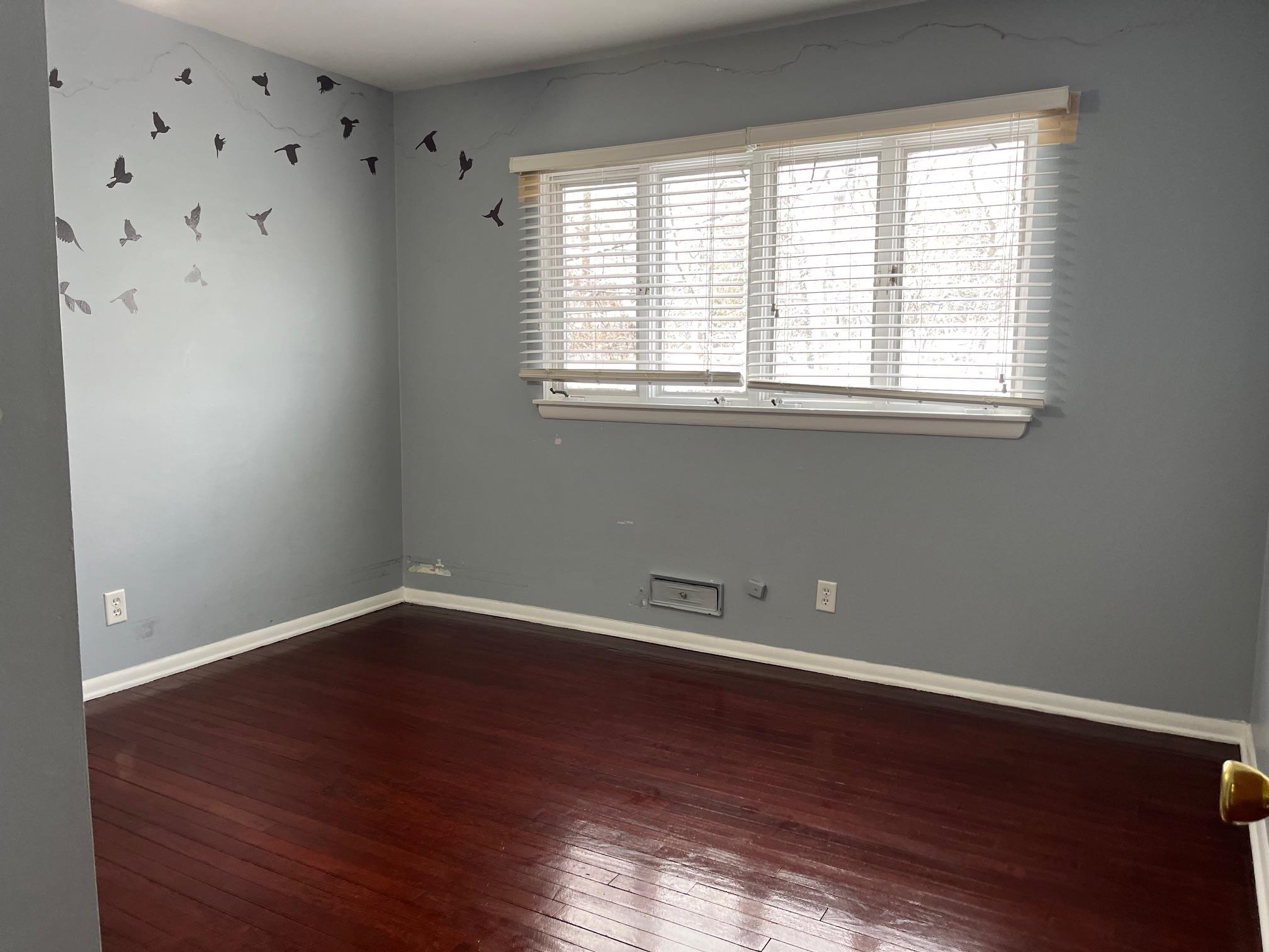 4909 Mohawk Road Rockford, IL 61107 - Photo 24 of 44 wooden floor in an empty room with a window