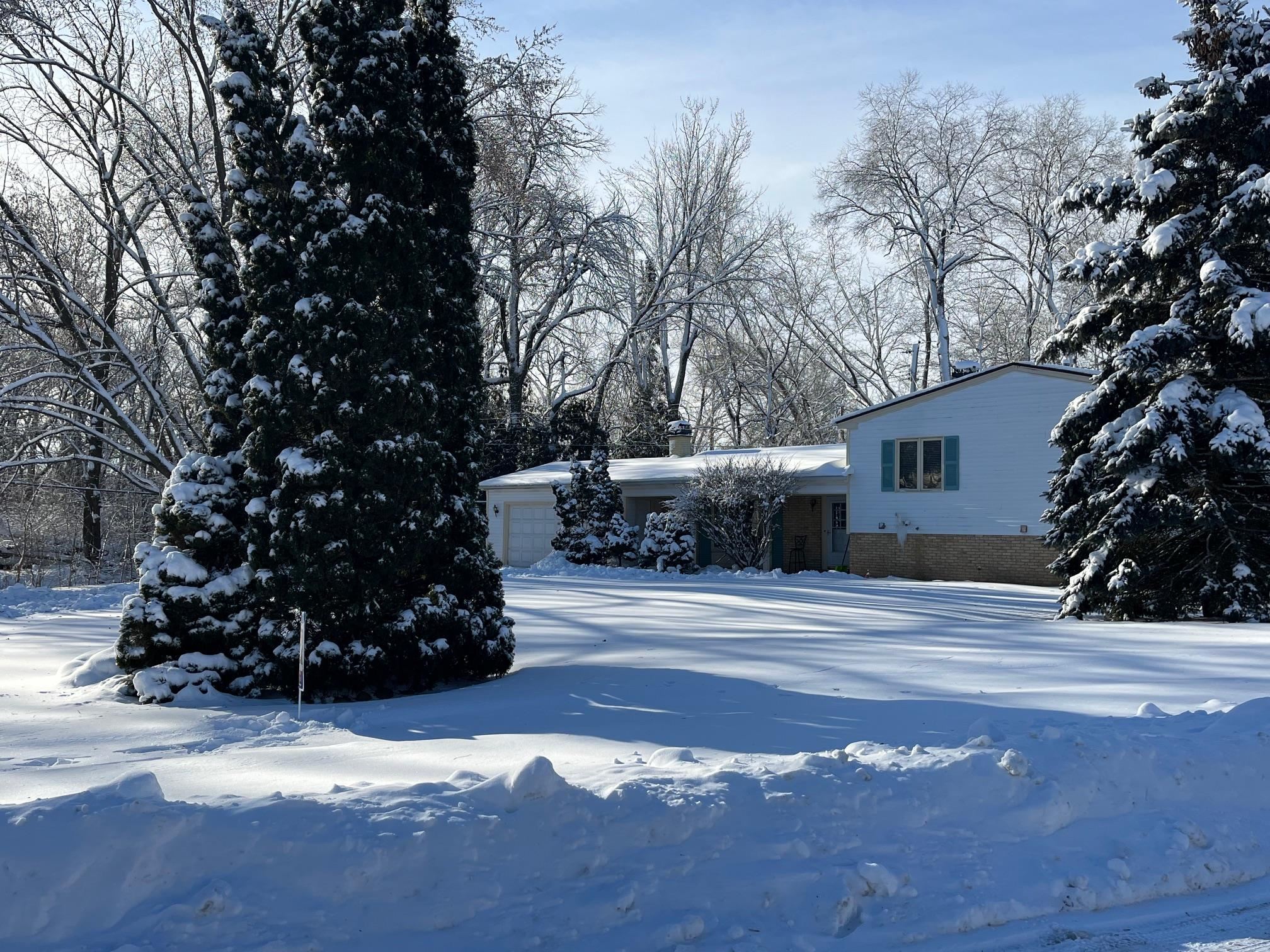 4909 Mohawk Road Rockford, IL 61107 - Photo 43 of 44 a view of a house with a snow in the yard