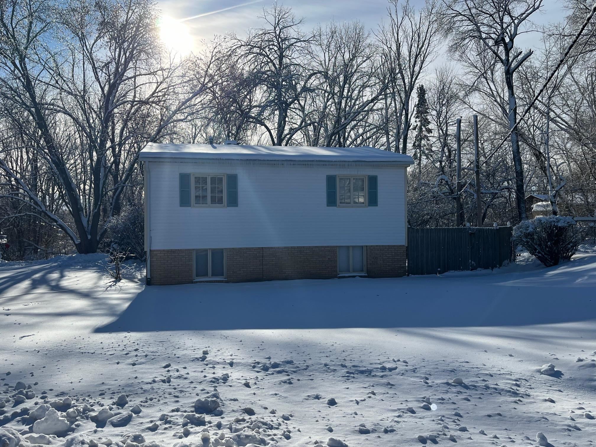 4909 Mohawk Road Rockford, IL 61107 - Photo 44 of 44 a view of a house with a yard