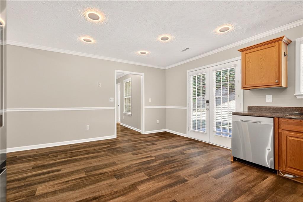 220 Windpher Ridge Hampton, GA 30228 - Photo 18 of 42 a view of an empty room with window and wooden floor