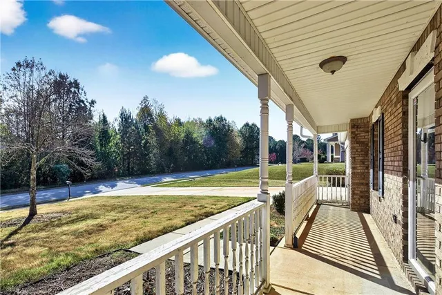 a view of a balcony with floor to ceiling windows