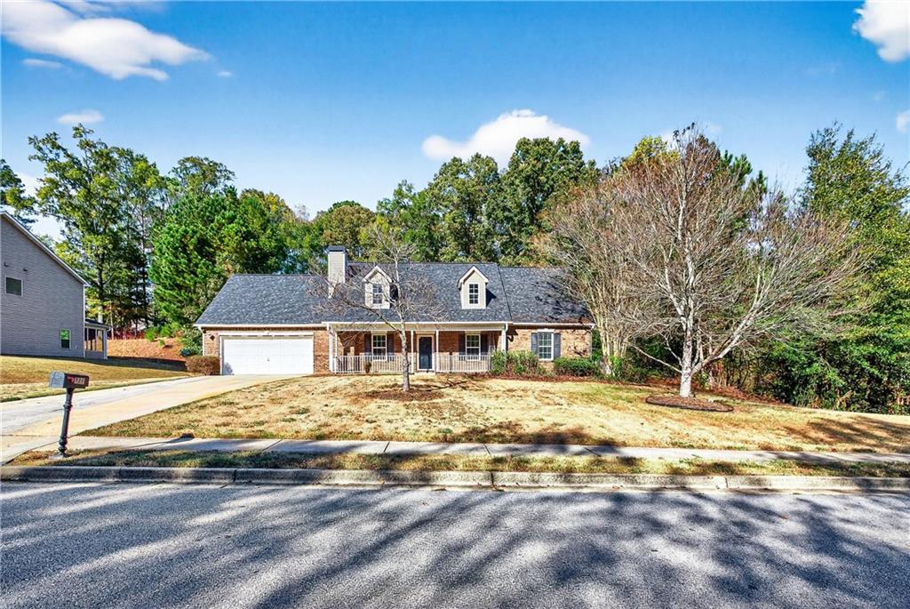 220 Windpher Ridge Hampton, GA 30228 - Photo 28 of 42 a front view of a house with a yard