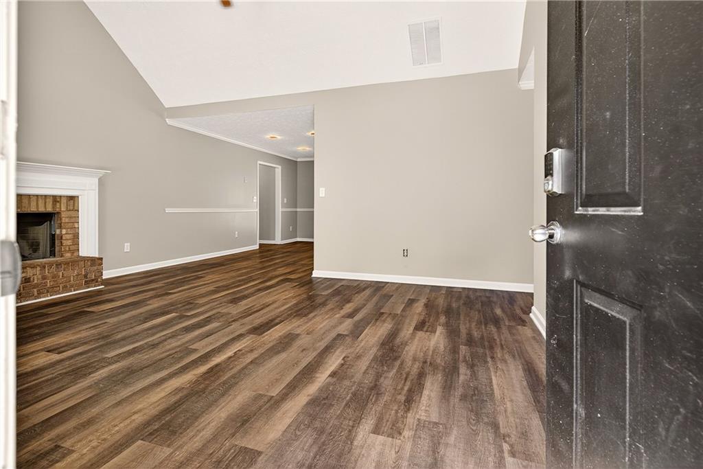 220 Windpher Ridge Hampton, GA 30228 - Photo 3 of 42 a view of an empty room with wooden floor