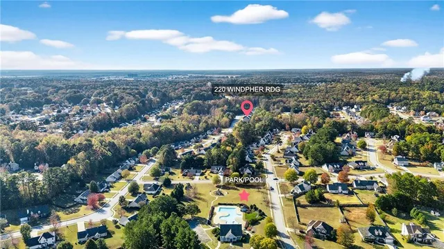 front view of a house with a tree