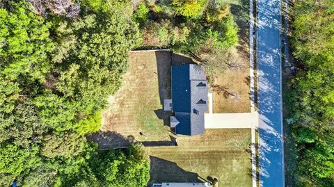 aerial view of a house with a garden and plants