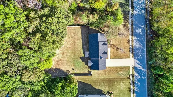 aerial view of a house with a garden and plants