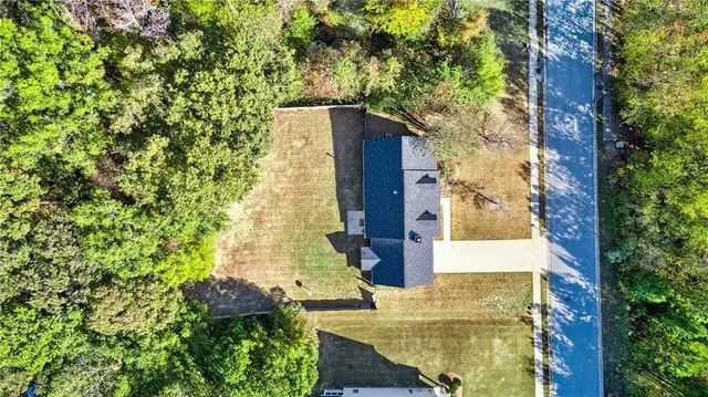 aerial view of a house with a garden and plants