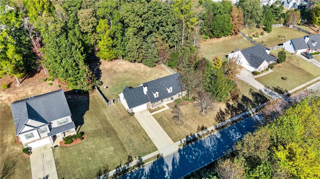 220 Windpher Ridge Hampton, GA 30228 - Photo 38 of 42 an aerial view of a house with a yard and lake view