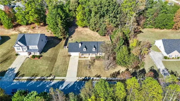 an aerial view of residential houses with outdoor space