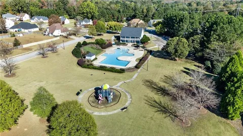 a view of swimming pool with a yard