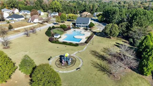 a view of swimming pool with a yard