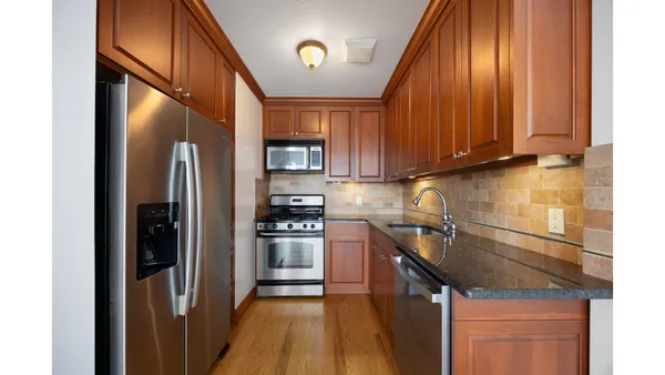 a kitchen with a sink and cabinets