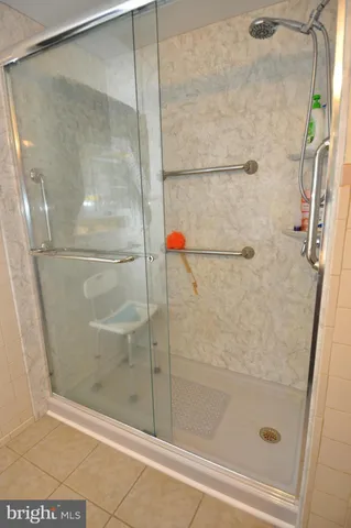a bathroom with a glass shower door