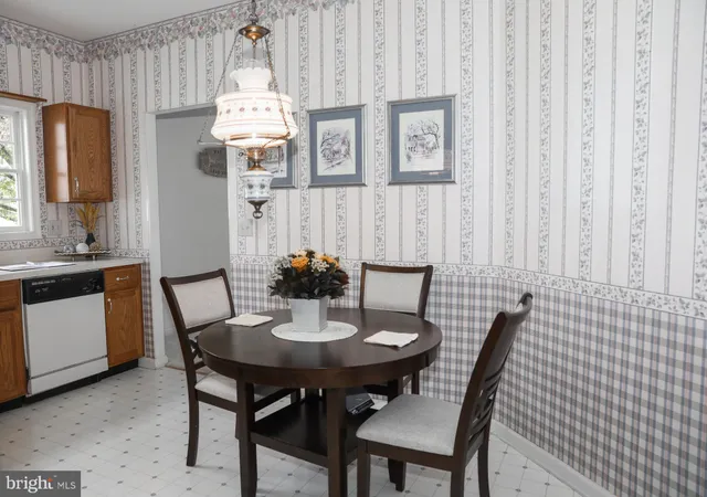 a view of a dining room with furniture and window