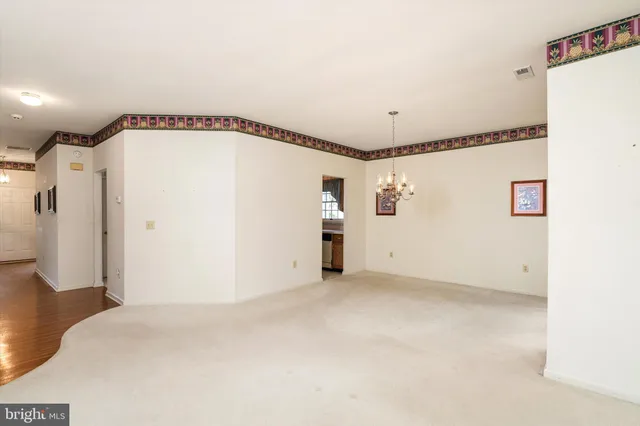 a view of a room with an entryway