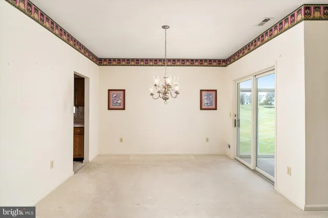 a view of a hallway with a large window