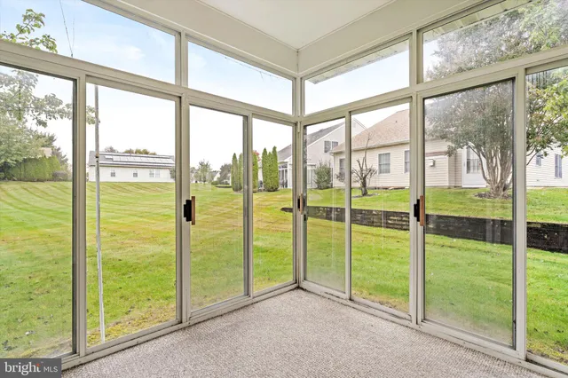 a view of a room with yard from a window