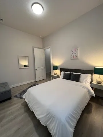 a bedroom with bed and window