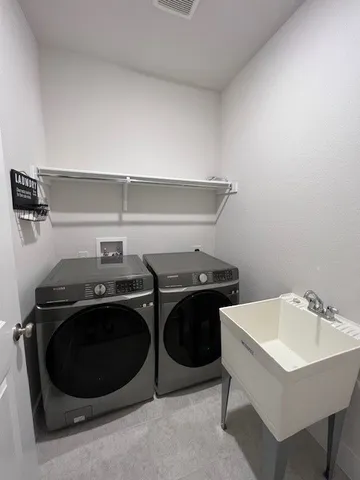 a utility room with dryer and washer
