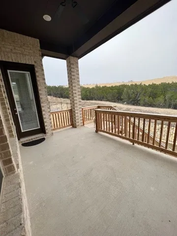 a view of balcony with furniture