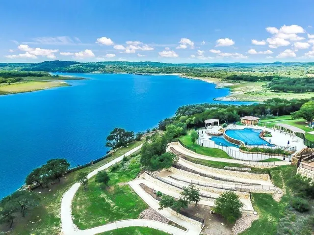 a view of a lake with a swimming pool