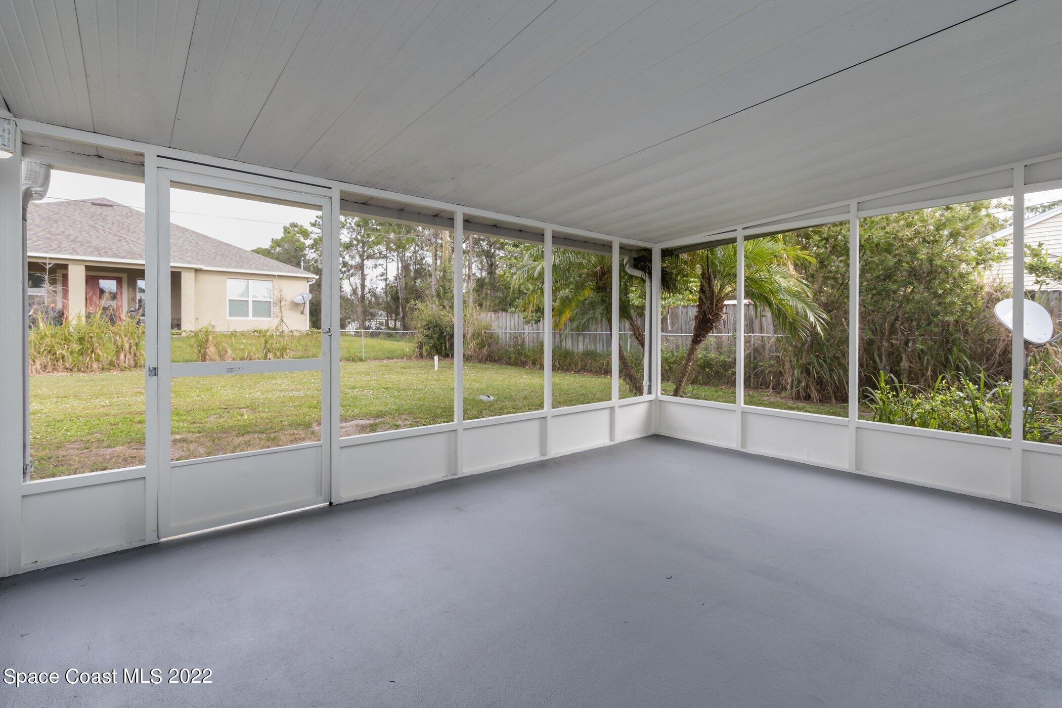 919 Commerce Road Southeast Palm Bay, FL 32909 - Photo 3 of 36 Screened Patio