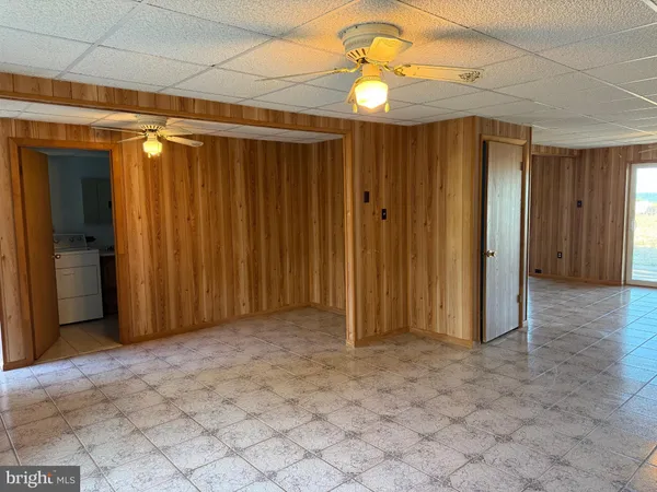 a view of gallery with wooden floor